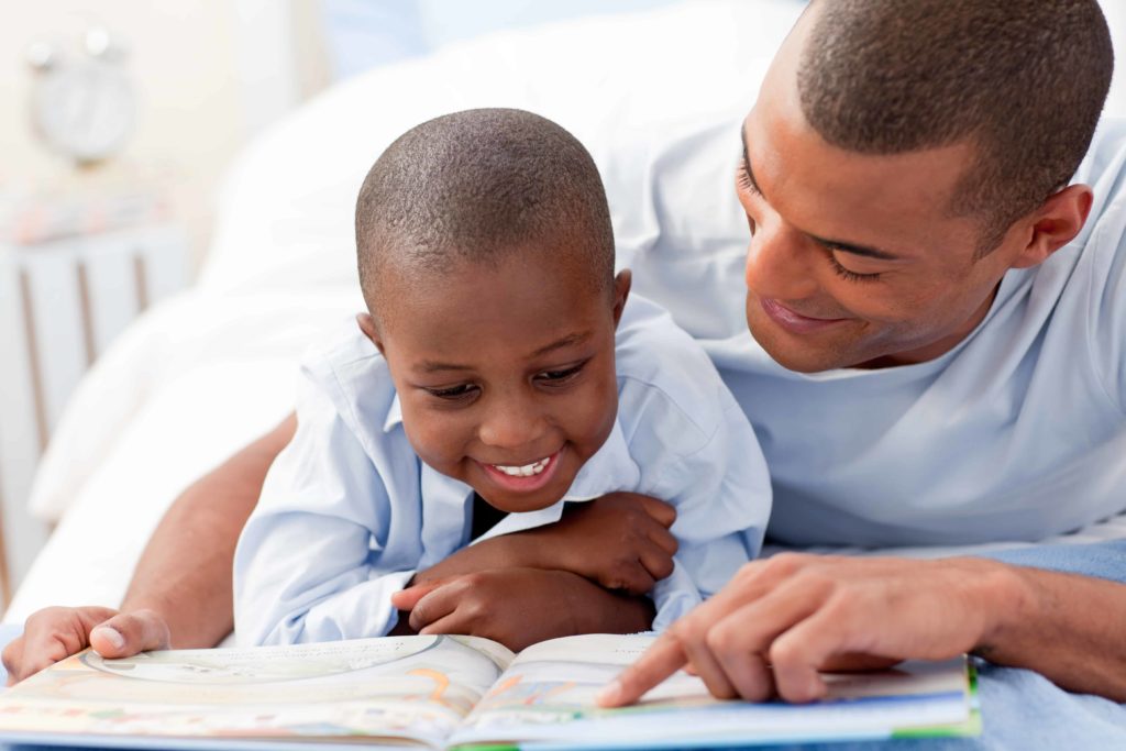 Father reading with his son